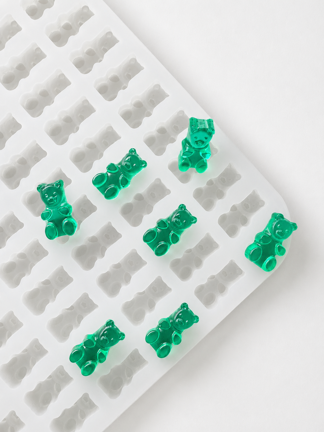 1.5mL gummy bear silicone mold with 296 cavities and emerald-green gummy samples