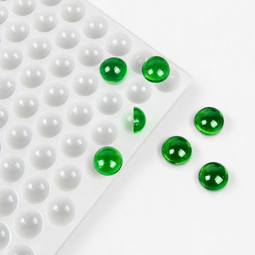 2.6mL hemisphere gummy mold with 202 cavities filled with translucent green sample gummies