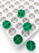 7mL 4-piece disc breaker gummy mold with 70 round segmented cavities and emerald green gummies