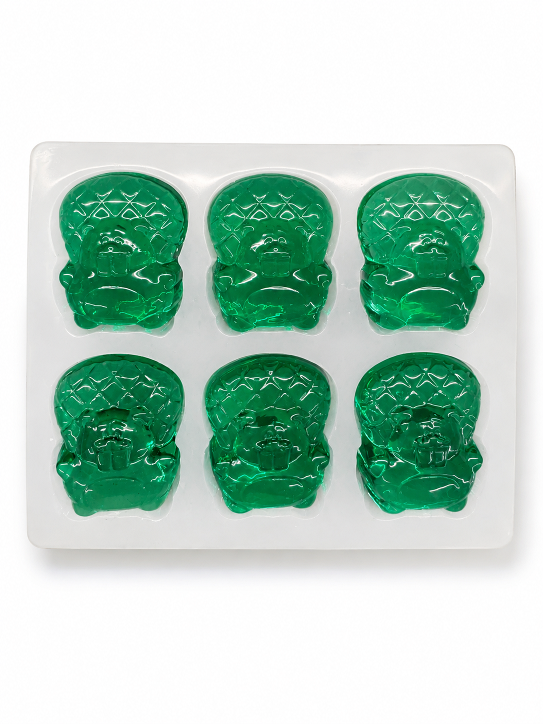 Custom beaver gummy mold prototype with six emerald green gummies on a white background